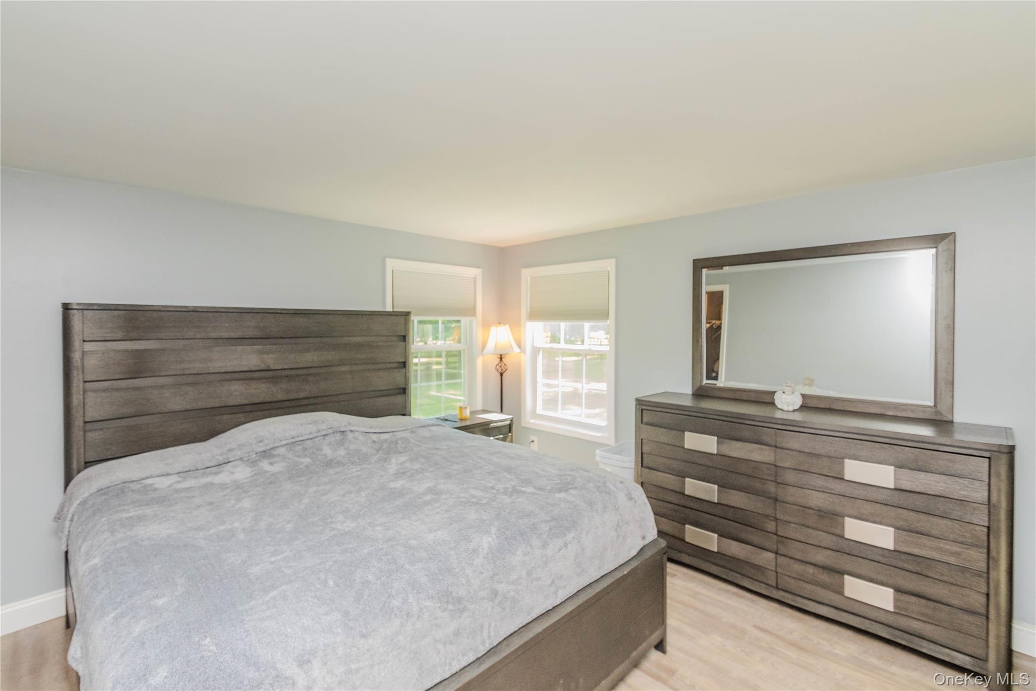 15 Van Dewark Road Middletown, NY 10941 - Photo 24 of 41 Bedroom featuring light wood-finish flooring and two windows with roller shades