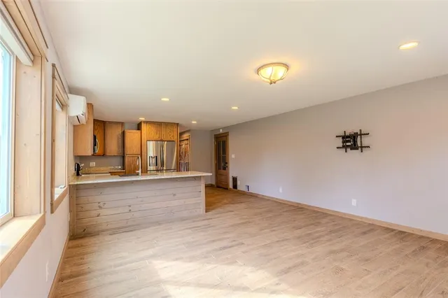 a view of a kitchen with a sink and cabinets