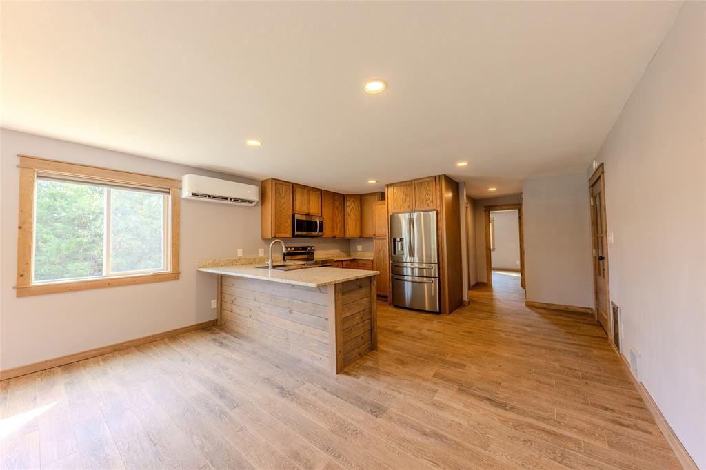 984 County Rd SE 4350 Scroggins, TX 75480 - Photo 13 of 35 a view of a kitchen with a sink and a large window