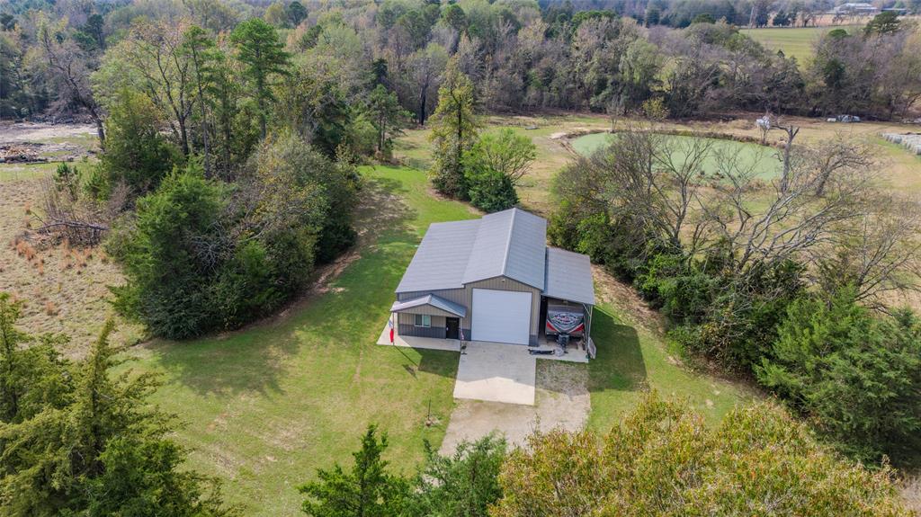 984 County Rd SE 4350 Scroggins, TX 75480 - Photo 32 of 35 an aerial view of house with yard swimming pool and outdoor seating