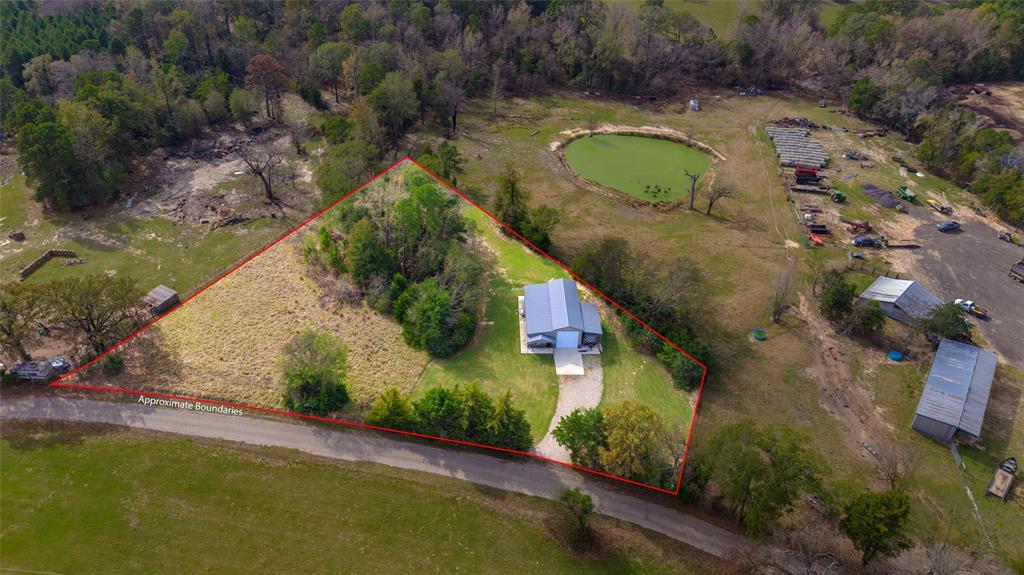 984 County Rd SE 4350 Scroggins, TX 75480 - Photo 35 of 35 an aerial view of a house with a yard and lake view