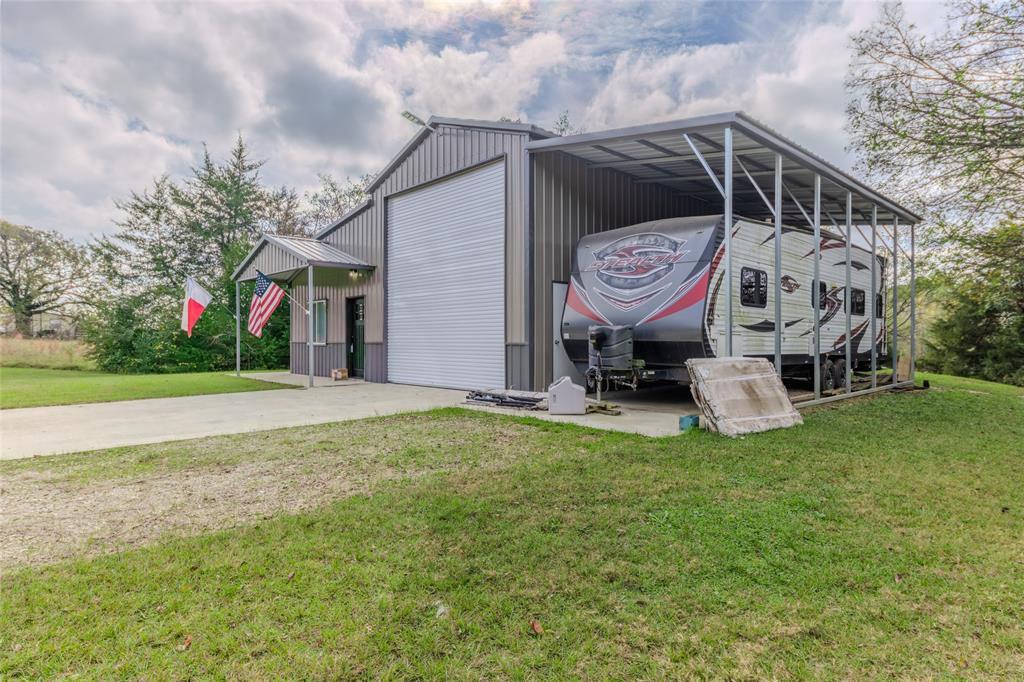 984 County Rd SE 4350 Scroggins, TX 75480 - Photo 4 of 35 a front view of a house with garden