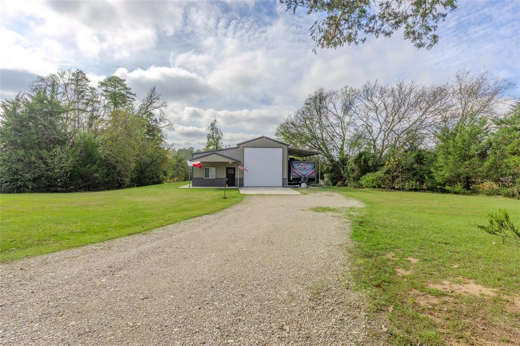 984 County Rd SE 4350 Scroggins, TX 75480 - Photo 7 of 35 a view of a house with a yard and garage