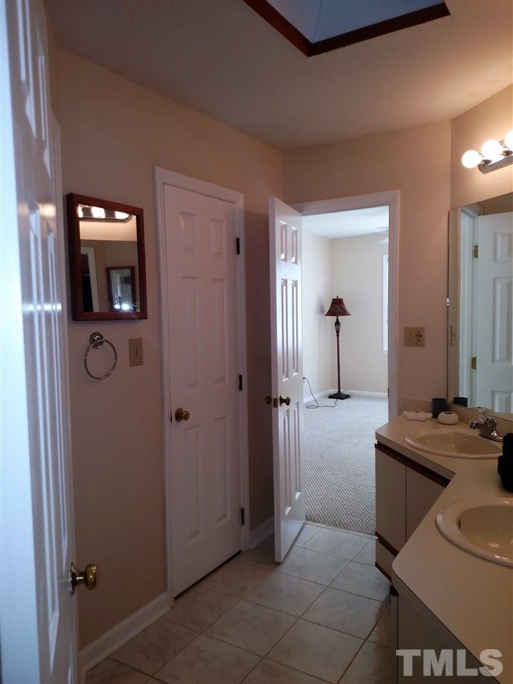 131 Renwick Court Raleigh, NC 27615 - Photo 16 of 21 a view of a livingroom from a hallway