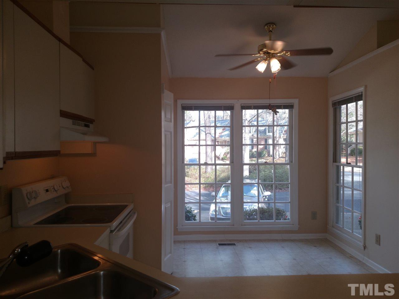 131 Renwick Court Raleigh, NC 27615 - Photo 5 of 21 a view of a livingroom with a ceiling fan and window