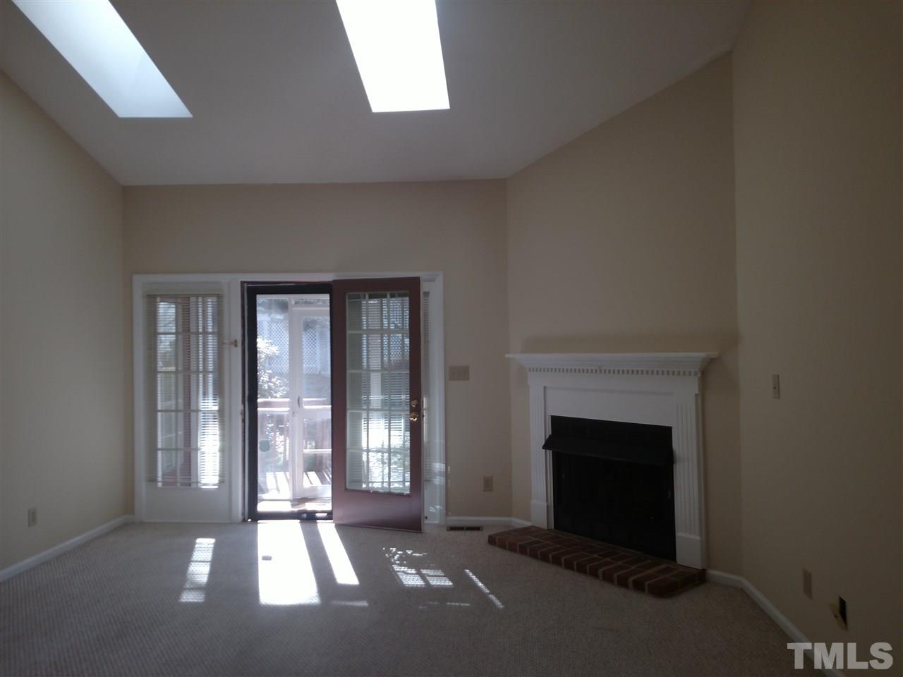 131 Renwick Court Raleigh, NC 27615 - Photo 10 of 21 a living room with a fireplace