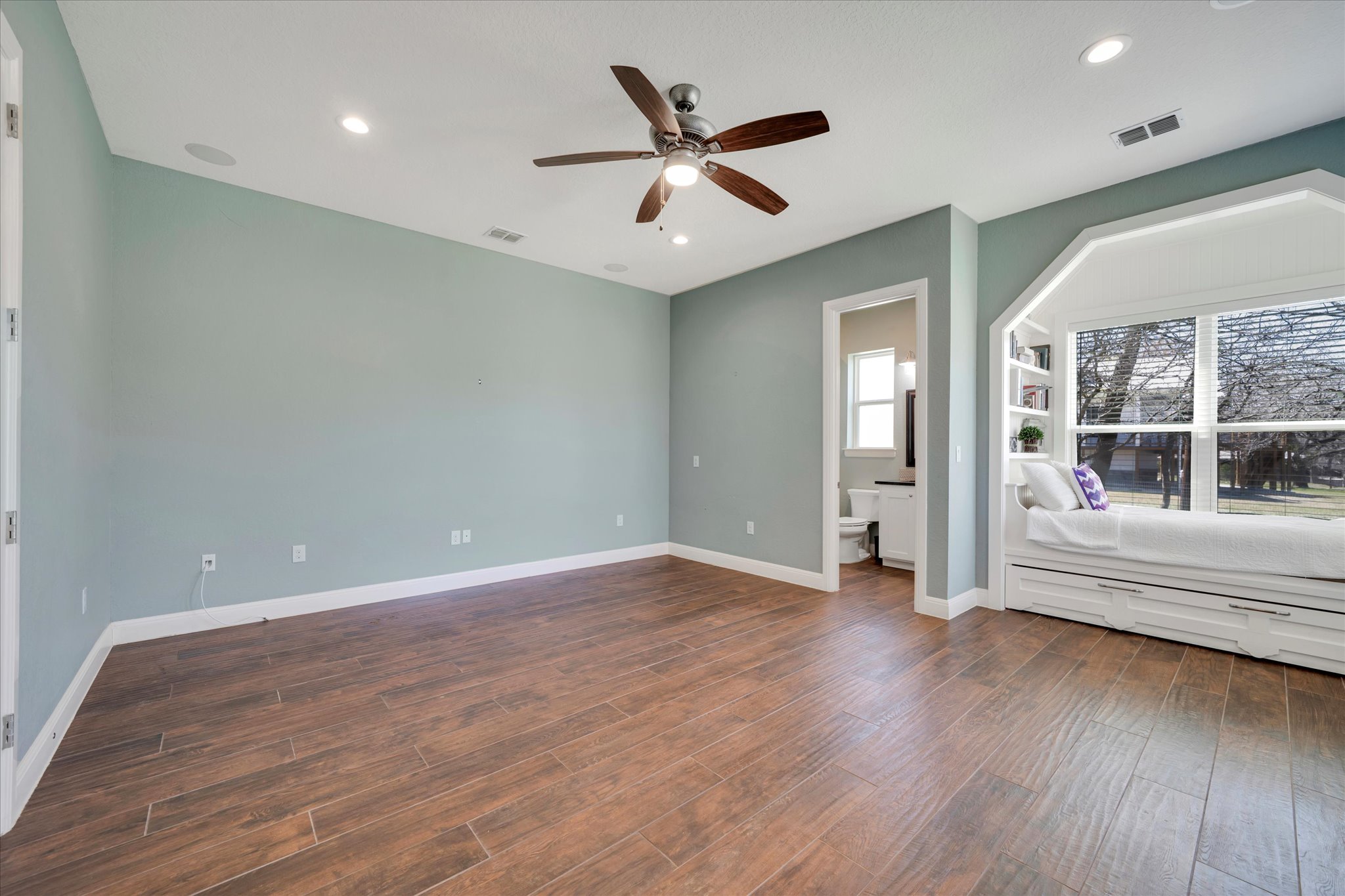 204 West Blanco Bend Drive Wimberley, TX 78676 - Photo 17 of 34 a view of empty room with wooden floor and fan