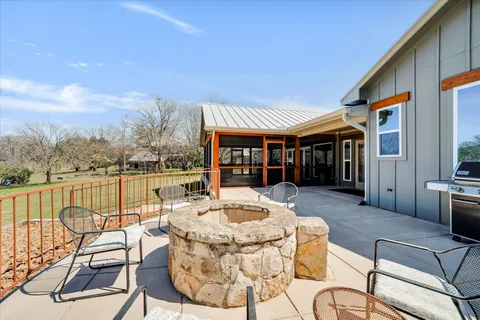 an aerial view of a house with outdoor space