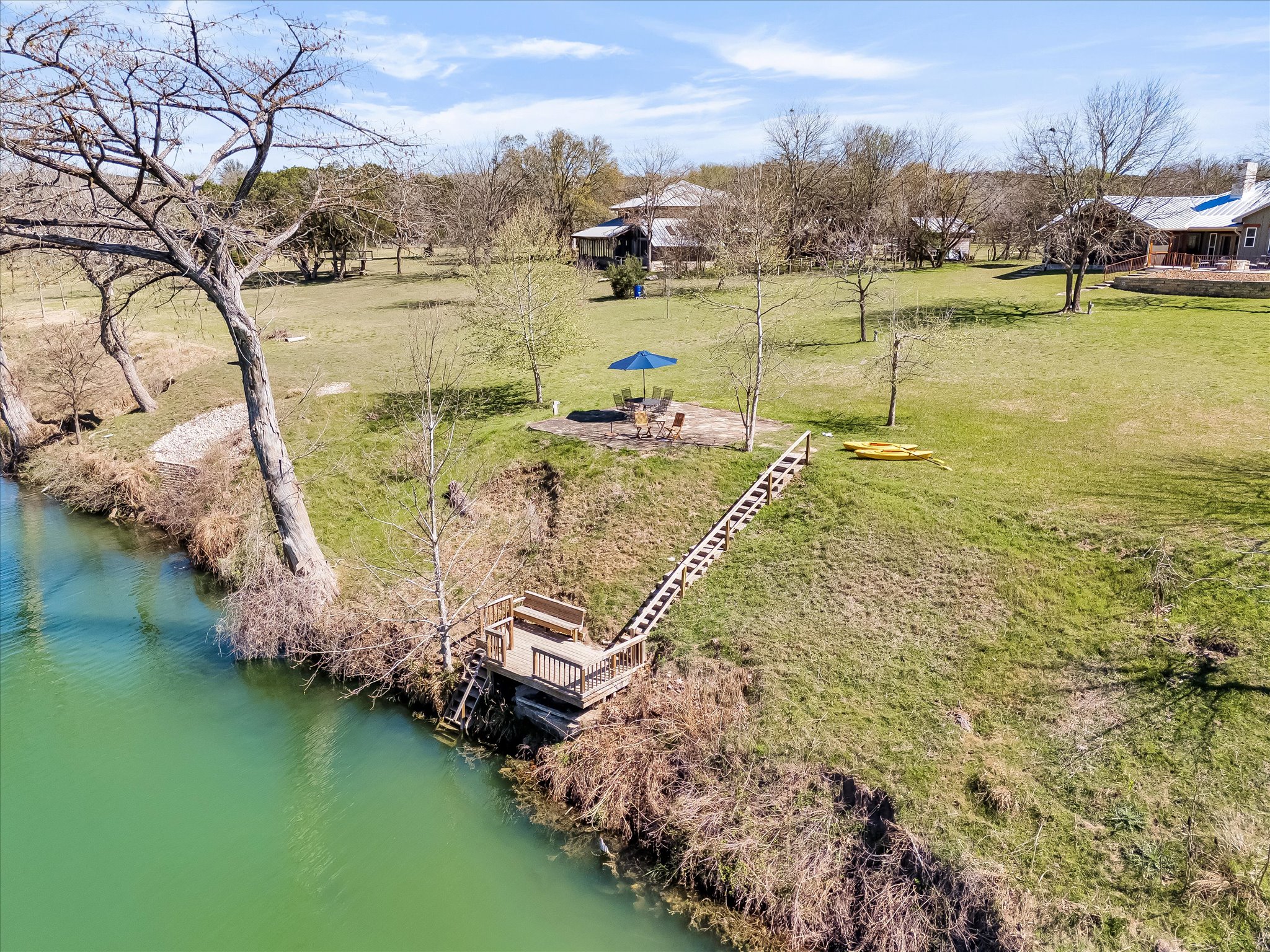 204 West Blanco Bend Drive Wimberley, TX 78676 - Photo 32 of 34 a view of a lake with houses