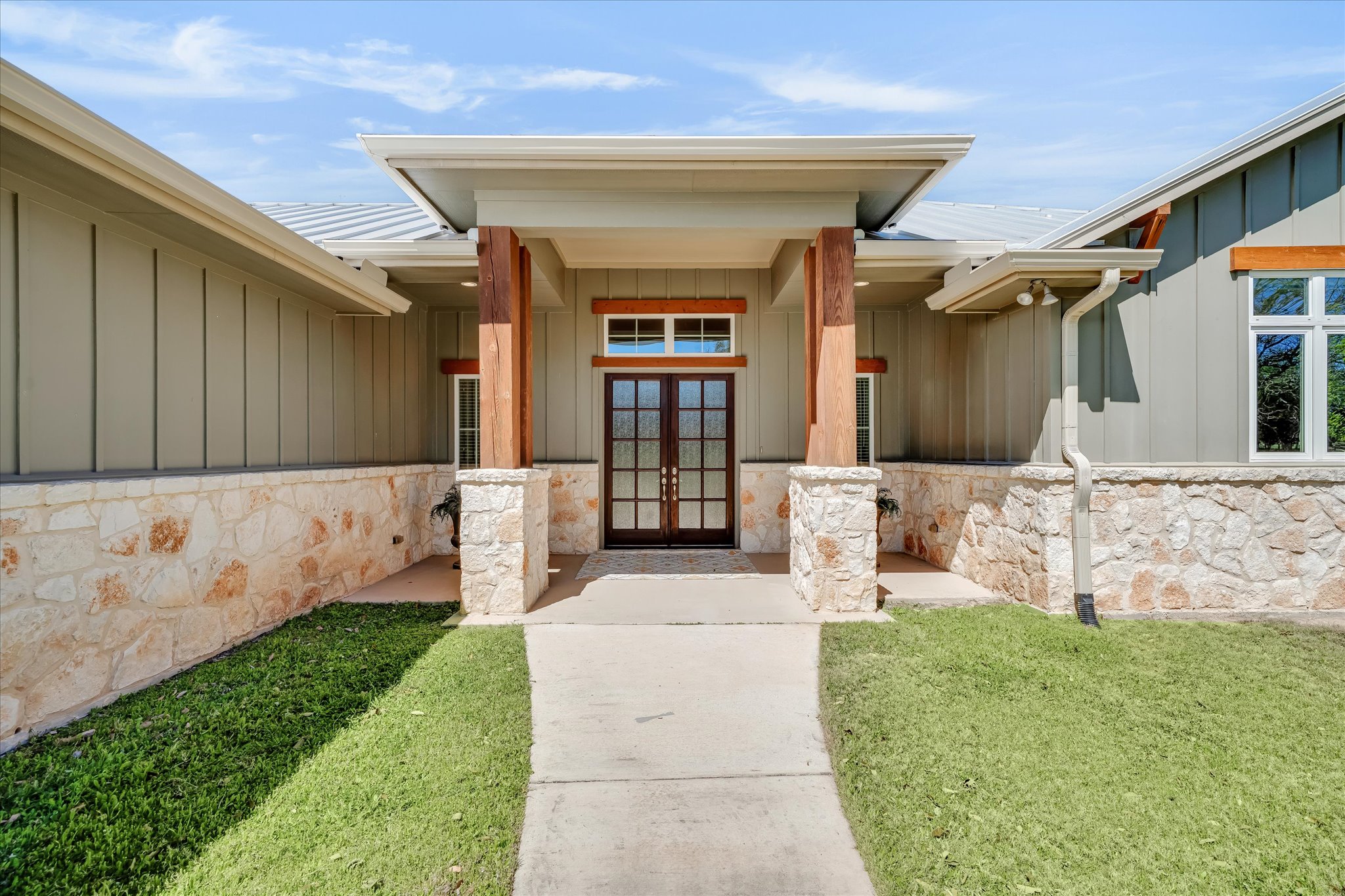 204 West Blanco Bend Drive Wimberley, TX 78676 - Photo 5 of 34 a front view of a house with garden