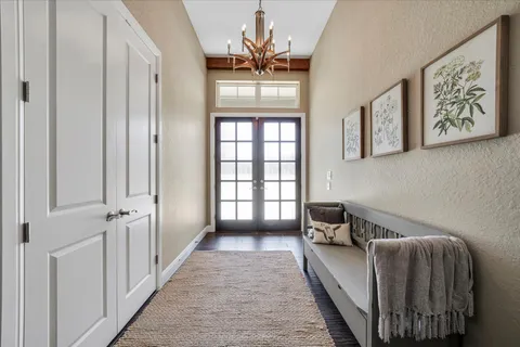 a living room with a bed furniture and a window