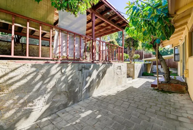 a view of a backyard with sitting area