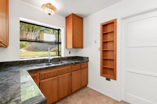 a room with a sink and a window