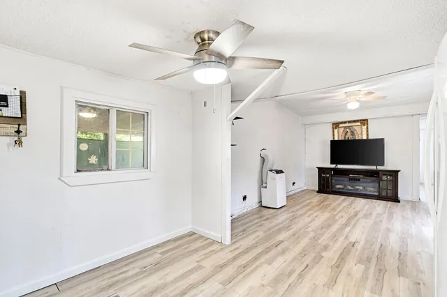 a view of living room with furniture and a flat screen tv