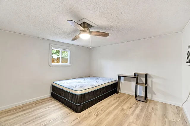 a view of workspace with wooden floor and window