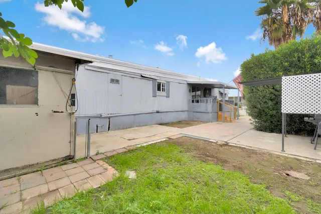 a house view with a backyard space