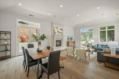 a view of a dining room with furniture and window