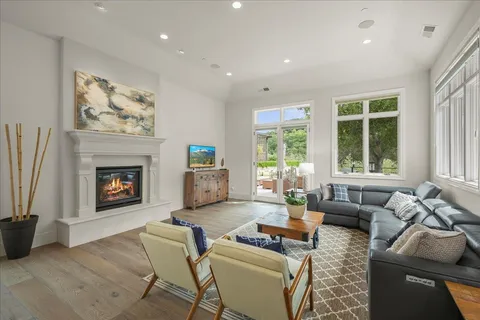 a large kitchen with a table and chairs