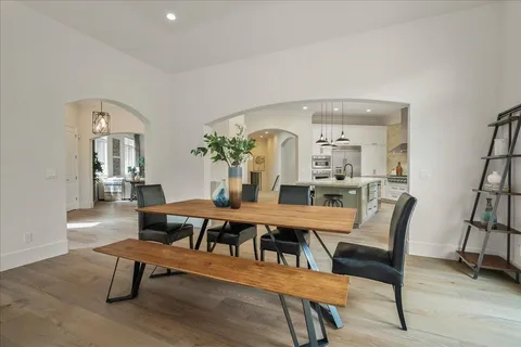 a kitchen with appliances a sink and cabinets
