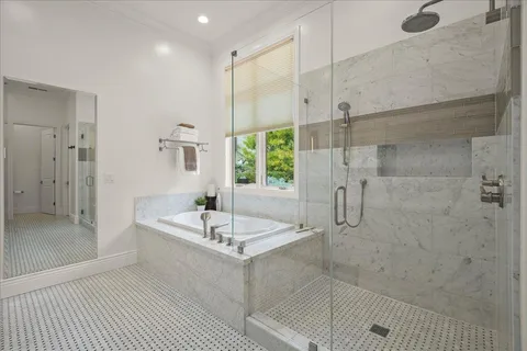 a spacious bathroom with a toilet sink and mirror