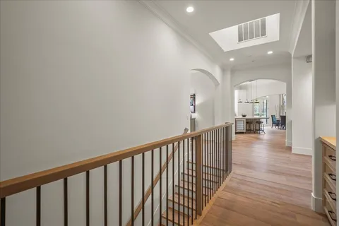 a view of a patio with a table and chairs under an umbrella