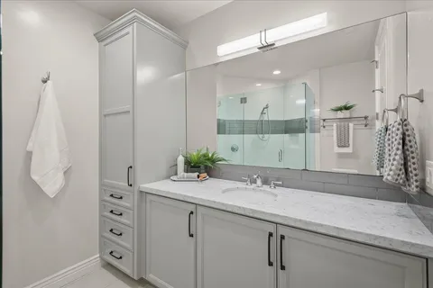 a view of a lake with couches and wooden floor