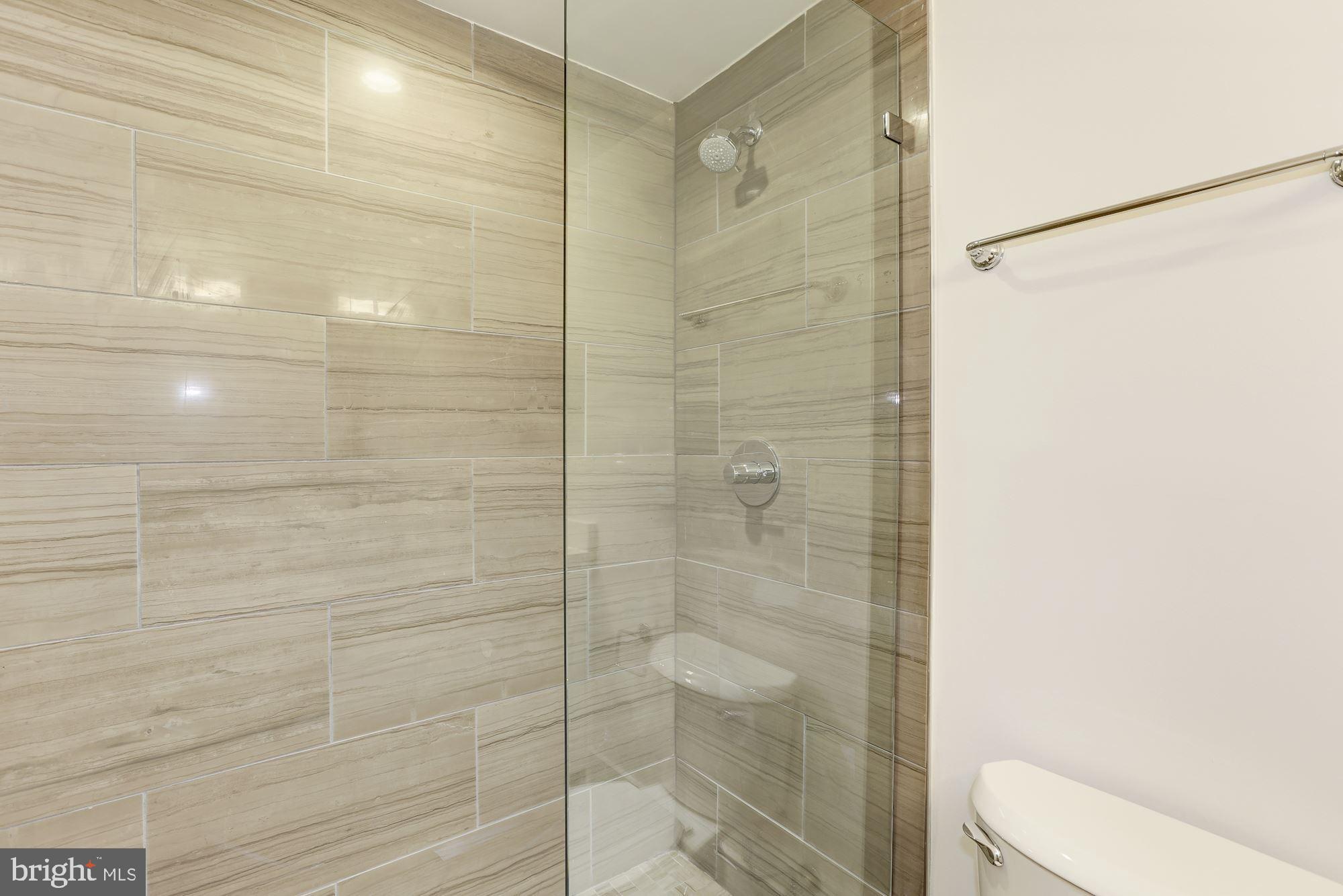 4008 Edmunds Street Northwest, Unit 6 Washington, DC 20007 - Photo 23 of 31 a bathroom with a shower and a toilet