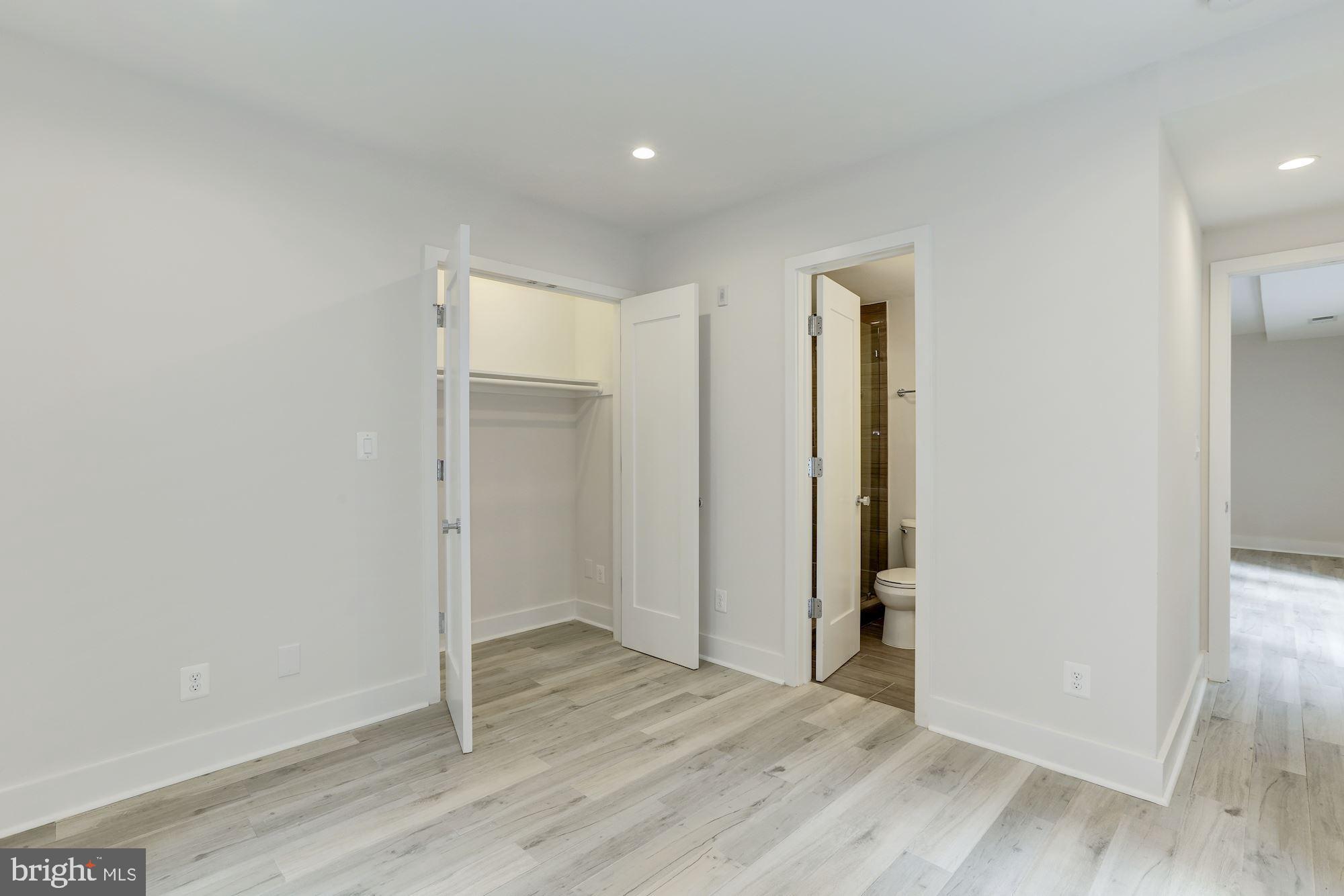 4008 Edmunds Street Northwest, Unit 6 Washington, DC 20007 - Photo 25 of 31 an empty room with wooden floor & windows