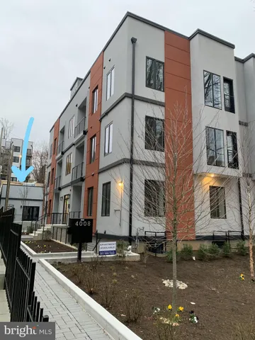 a view of a brick building with many windows