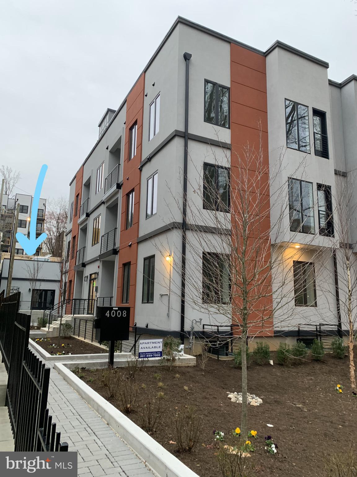 4008 Edmunds Street Northwest, Unit 6 Washington, DC 20007 - Photo 28 of 31 a view of a brick building with many windows