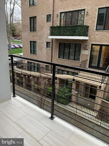 a view of a brick building with many windows