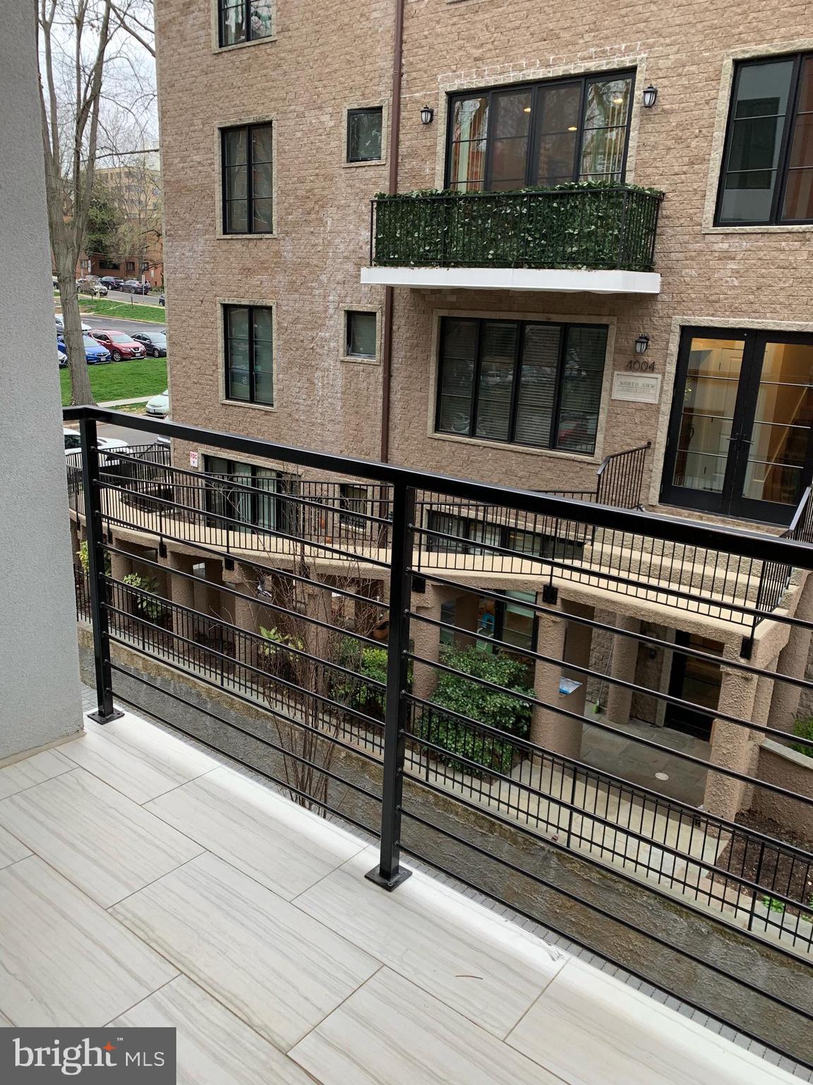 4008 Edmunds Street Northwest, Unit 6 Washington, DC 20007 - Photo 5 of 31 a view of a brick building with many windows