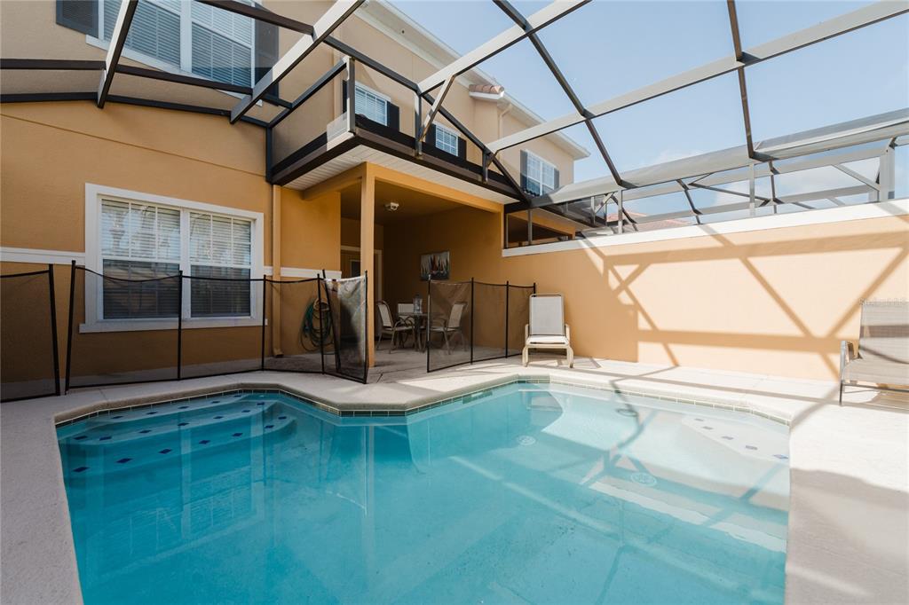 8961 Majesty Palm Road Kissimmee, FL 34747 - Photo 19 of 40 a view of a porch with seating space