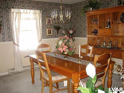 2533 Beacon Road Bath, PA 18014 - Photo 5 of 11 a dining room with furniture a rug and a chandelier