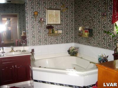 2533 Beacon Road Bath, PA 18014 - Photo 9 of 11 a bath tub sitting in a bathroom and mirror