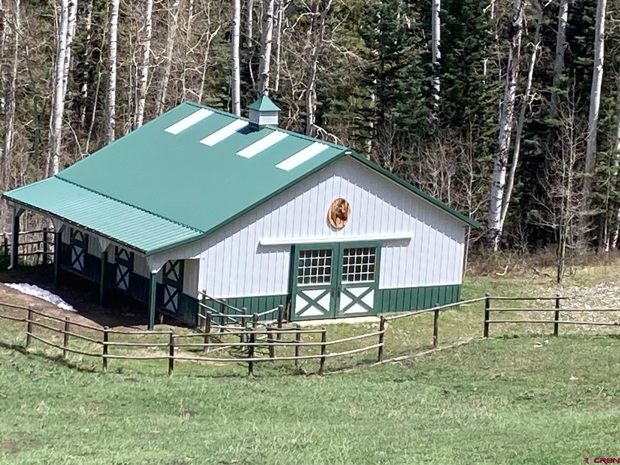 361 Golden Ridge Drive Ridgway, CO 81432 - Photo 4 of 25 a view of a house with backyard and a tree