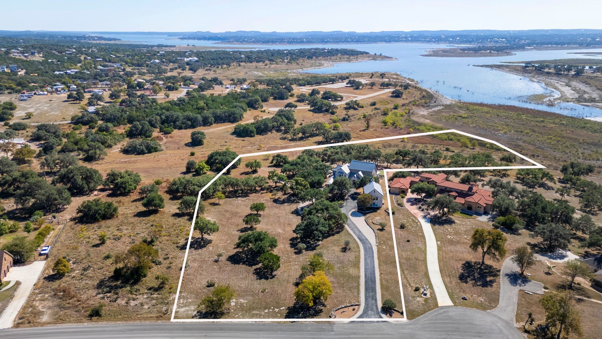 185 Shimmering Shore Court Spring Branch, TX 78070 - Photo 32 of 36 Aerial overview of property's location featuring property boundaries highlighted and a nearby body of water
