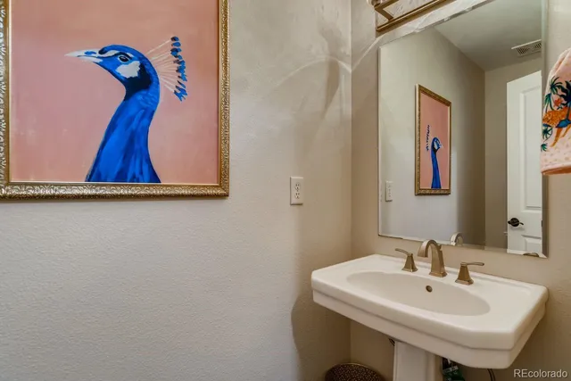 a bathroom with a sink and mirror