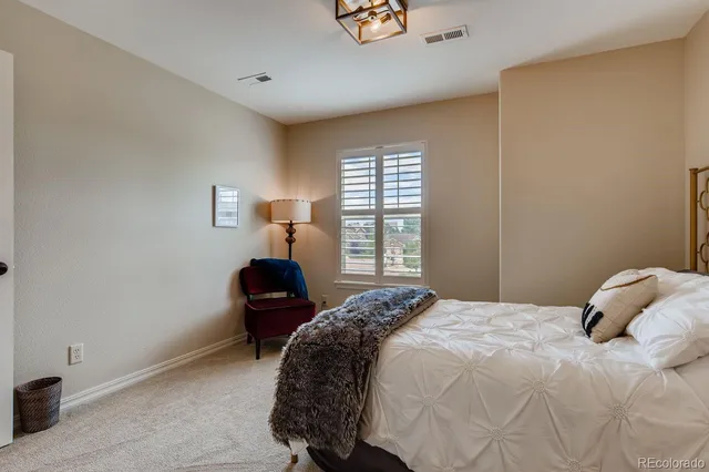 a bedroom with a bed and a television