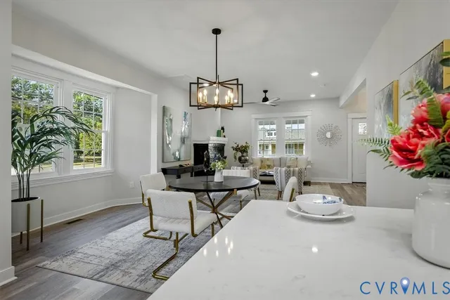 a view of a dining room with furniture window and wooden floor