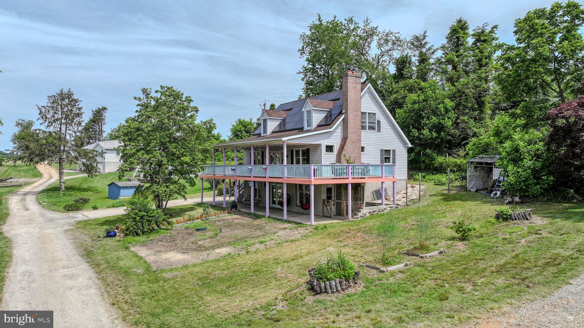 210 Elk View Road North East, MD 21901 - Photo 2 of 64 a view of a house with a yard deck and sitting area