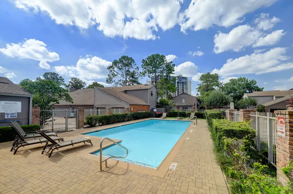 a view of a backyard with a patio
