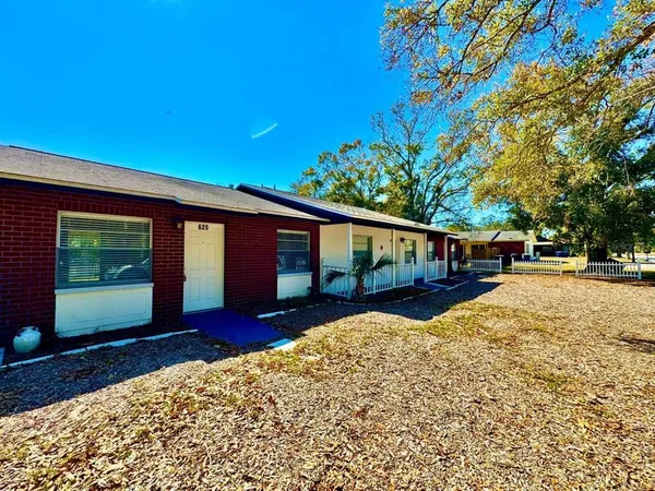 a house with yard in front of it