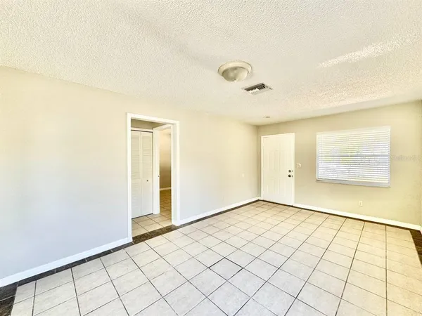 a kitchen with a stove a sink and a refrigerator