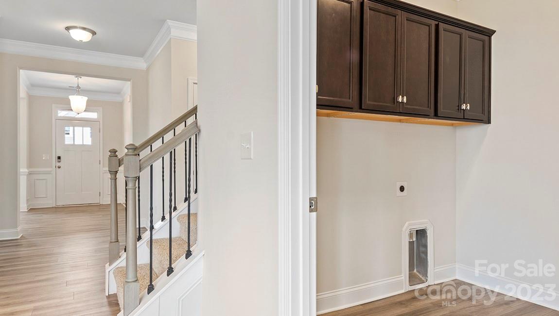 245 Fox Cove Road Hendersonville, NC 28792 - Photo 15 of 33 a view of a hallway with wooden floor and staircase