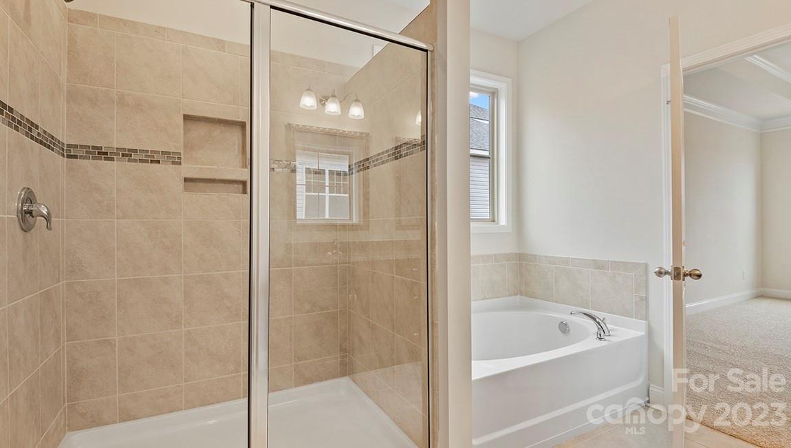 245 Fox Cove Road Hendersonville, NC 28792 - Photo 19 of 33 a bathroom with a bathtub and shower