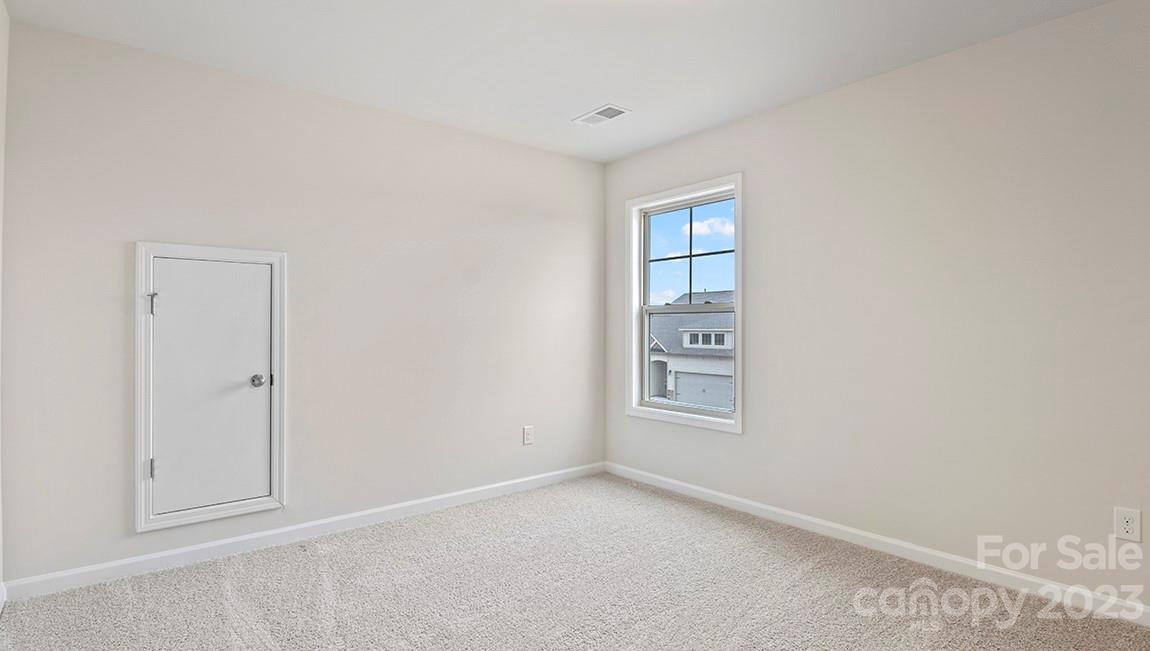 245 Fox Cove Road Hendersonville, NC 28792 - Photo 27 of 33 a view of an empty room with a window