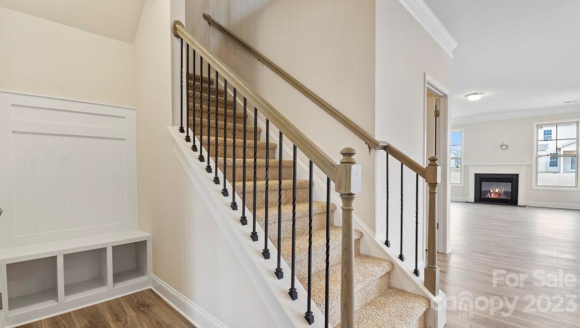 245 Fox Cove Road Hendersonville, NC 28792 - Photo 8 of 33 a view of a hallway with wooden floor and staircase