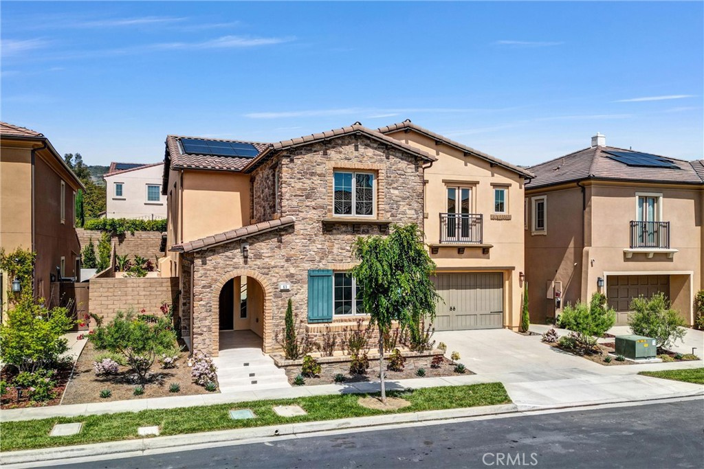 63 Poncho Irvine, CA 92602 - Photo 1 of 1 a front view of a house with garden and plants