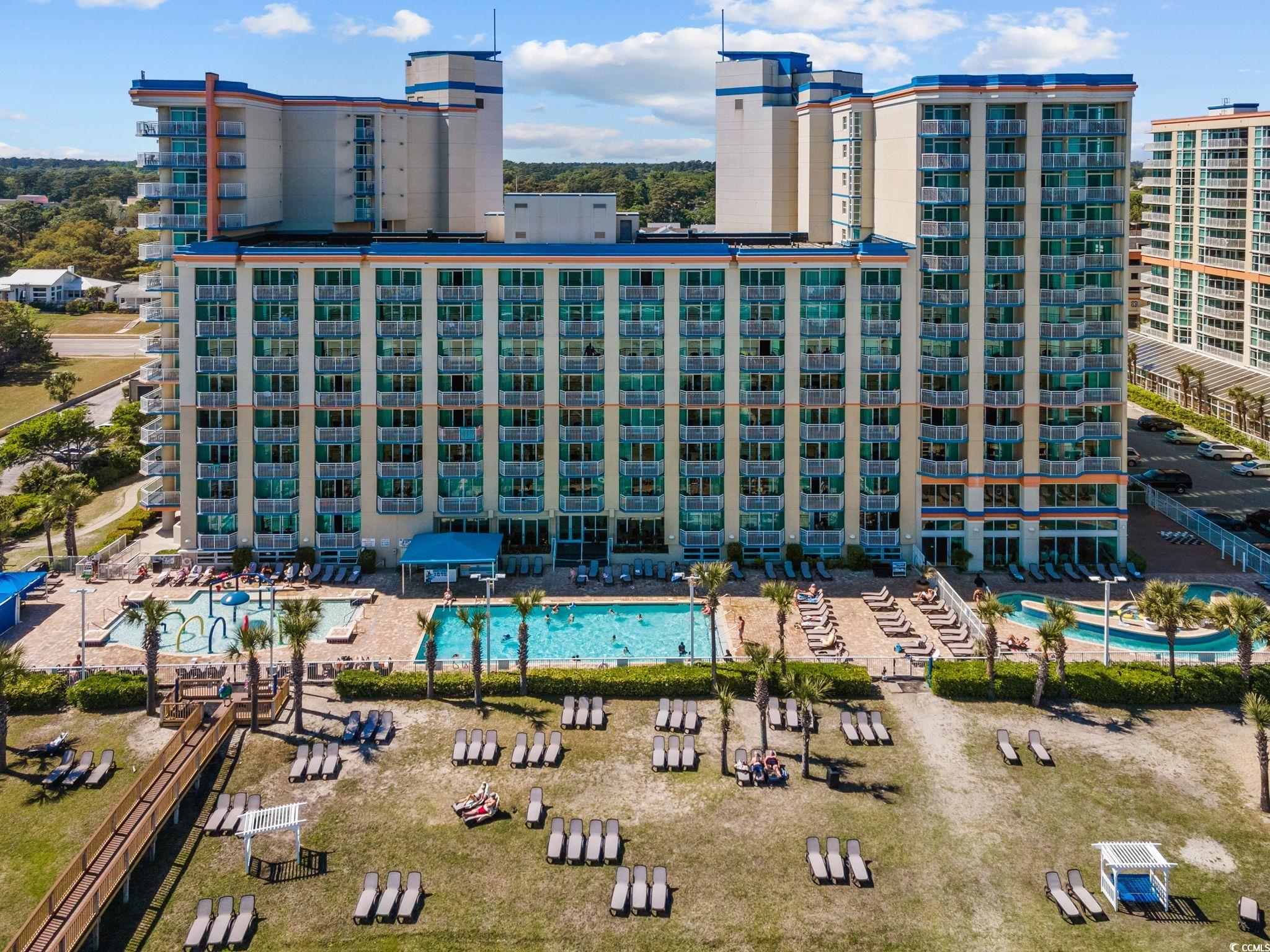 5200 North Ocean Boulevard, Unit 857 Myrtle Beach, SC 29577 - Photo 1 of 40 View of building exterior featuring a community pool